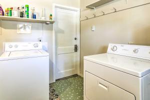 a laundry room with a washer and dryer at Modern Rapid City Duplex Less Than 10 Mi to Natl Forest! in Rapid City +16 photos