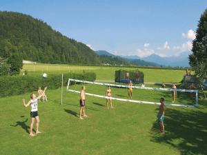 a group of people playing a game of soccer at Hotel Pachernighof in Velden am Wörthersee