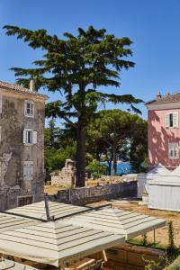 a pile of wooden pallets in front of a building at Martis Forum Heritage Hotel & Residence in Poreč