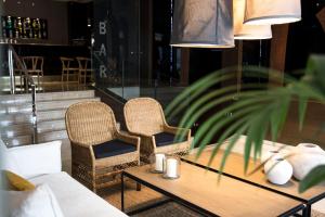 two chairs and a table in a room at Zenit Valencia in Valencia