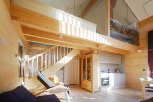 a room with a staircase in a tiny house at Bio Ferienwohnung am Wildsee in Seefeld in Seefeld in Tirol