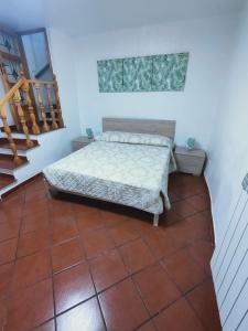 En eller flere senge i et værelse på La Casetta