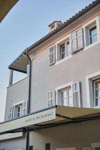 a building with a sign for a martinis restaurant at Martis Forum Heritage Hotel & Residence in Poreč