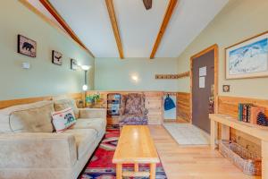 a living room with a couch and a table at Tahoe Treetop Escape in Stateline