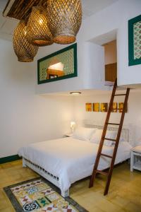 a bedroom with two bunk beds and a mirror at El Despertar Hotel in Jericó