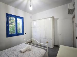 Postel nebo postele na pokoji v ubytování Villa Marzia & Villa Carmela