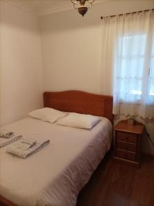Ένα ή περισσότερα κρεβάτια σε δωμάτιο στο Casa do Posto