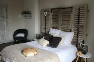 Postel nebo postele na pokoji v ubytování Chambre d'hôtes Les Magnolias