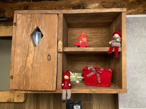 a wooden box with christmas items in it at Il Caso di Michael e Katia in Prazzo