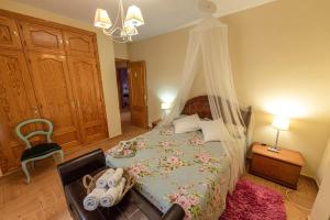 a bedroom with a bed with a canopy at Los Valles & Spa in Pepino +42 photos