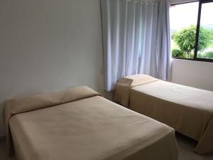 Postel nebo postele na pokoji v ubytování Flat térreo com duas suítes (até 8 pessoas) no Canarius Resort em Gravatá + 16 fotografií