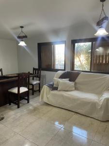 a living room with a couch and a table at CASA NUEVA in San Rafael