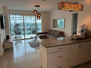 a kitchen and living room with a couch and a table at Morros Ultra 810 in Cartagena de Indias