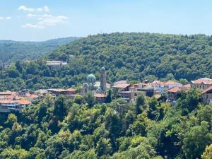 a small town in the middle of a hill at Hotel Comfort in Veliko Tŭrnovo
