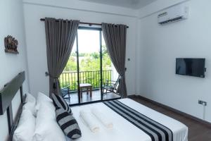 Postel nebo postele na pokoji v ubytování Black Mustang Hotel