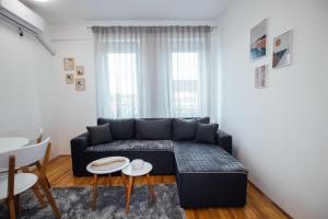 Ein Sitzbereich in der Unterkunft Apartman Vas dom