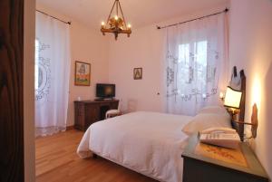 Ένα ή περισσότερα κρεβάτια σε δωμάτιο στο Hotel Le Torri