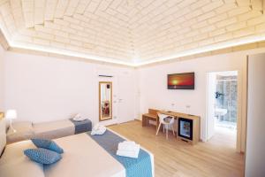 a living room with a couch and a table at I MORI HOTEL in San Vito lo Capo