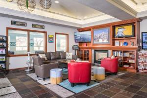 a living room with a couch and a fireplace at Wood River Inn & Suite in Hailey