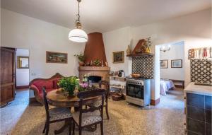 a kitchen and living room with a table and a couch at Amazing Home In Siena With Wifi in Siena