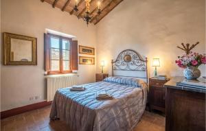 a bedroom with a bed and a dresser and a window at Amazing Home In Siena With Wifi in Siena