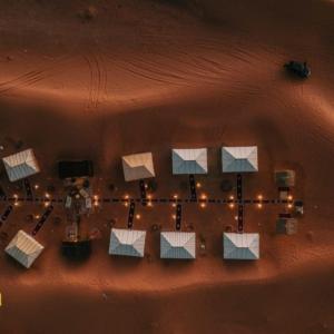 an aerial view of a building in the desert with lights at Fabulous luxury camp in Merzouga