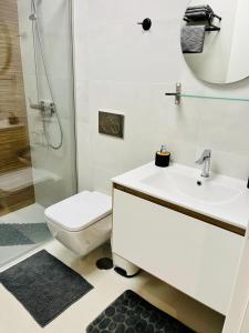 a bathroom with a sink and a toilet and a shower at NEW 2022 Casanovas-Apartment Torrevieja Center in Torrevieja