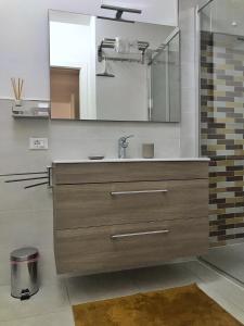 a bathroom with a sink and a mirror at Emily in Como