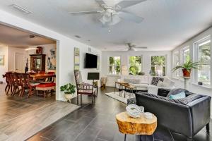 a living room with a couch and a table at Private Pool - ADA - Pet Friendly - Fenced Yard - 884 Oak Lane in Fernandina Beach