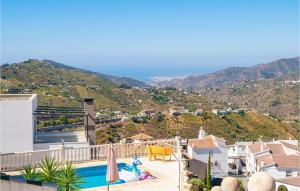 a view of a house with a swimming pool at Casa Anttonio in Cómpeta
