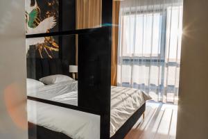 Posteľ alebo postele v izbe v ubytovaní Apartament Plaza Tower 14 Piętro