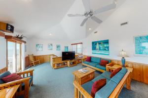 a living room with couches and a tv at Yalcrab #4-PA in Avon