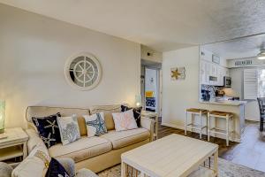 a living room with a couch and a table at Dunes Villas in Hilton Head Island