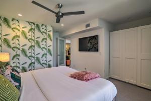 a bedroom with a bed and a ceiling fan at Chic Palm Springs Gem with Patio and Pool Access! in Palm Springs +17 photos