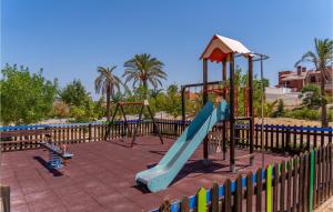 a playground with a blue slide in a park at Beautiful Home In Caravaca De La Cruz With Kitchen in Caravaca de la Cruz