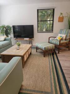 a living room with a couch and a coffee table at Welcome to The Bray Escape 4 miles to Siesta Key in Sarasota