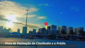 a city skyline with a red balloon in the sky at Apto na Praia de Atalaia a 100 metros da Passarela do Caranguejo in Aracaju