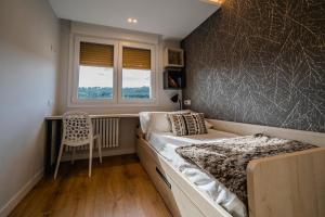Postel nebo postele na pokoji v ubytování Alfonso X - Apartamentos Burgos Deluxe
