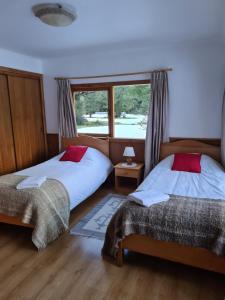 Postel nebo postele na pokoji v ubytování El Pangue Lodge