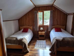 Postel nebo postele na pokoji v ubytování El Pangue Lodge