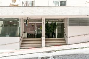 a entrance to a building with stairs in front at QUARTO INTEIRO com banheiro exclusivo Coração de Florianópolis in Florianópolis