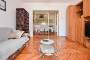 a living room with a couch and a table at Apartment Guliver in Biograd na Moru