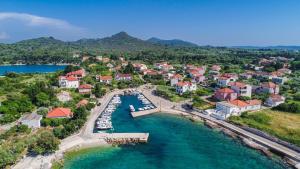 an aerial view of a resort with a harbor at Apartments with parking space Ugljan - 8479 in Ugljan