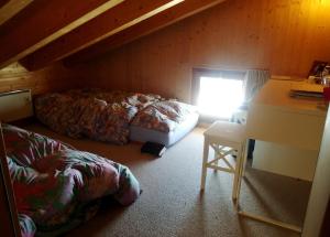 Ένα ή περισσότερα κρεβάτια σε δωμάτιο στο Snowshop Mario