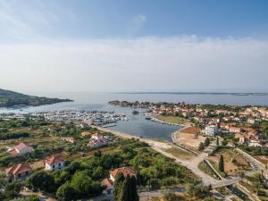 an aerial view of a small town next to a body of water at Seaside holiday house Sutomiscica, Ugljan - 15965 in Preko