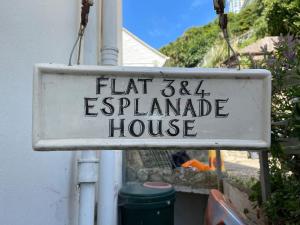 a sign that reads flat esplanade house at Pirates Place Ventnor Esplanade Beach and Sea Views in Ventnor
