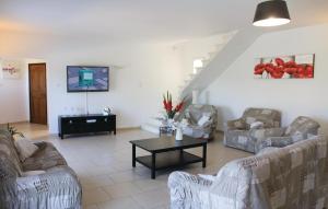 a living room with couches and a coffee table at 4 Bedroom Awesome Home In Apt in Apt