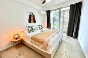 Uma cama ou camas num quarto em Tukenui flat discovering Papeete
