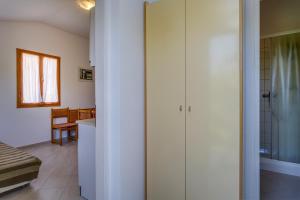 a bathroom with a shower and a sink in a room at Apartments by the sea Nerezine, Losinj - 2519 in Nerezine