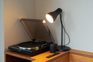 a lamp sitting on top of a radio on a table at BUNSHODO HOTEL in Fukuoka